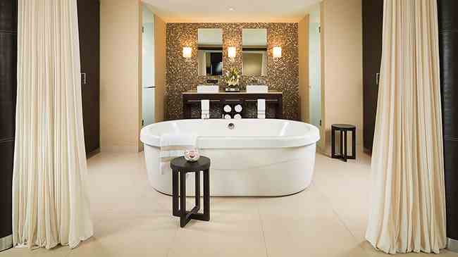 Luxurious jacuzzi style bath in a suite