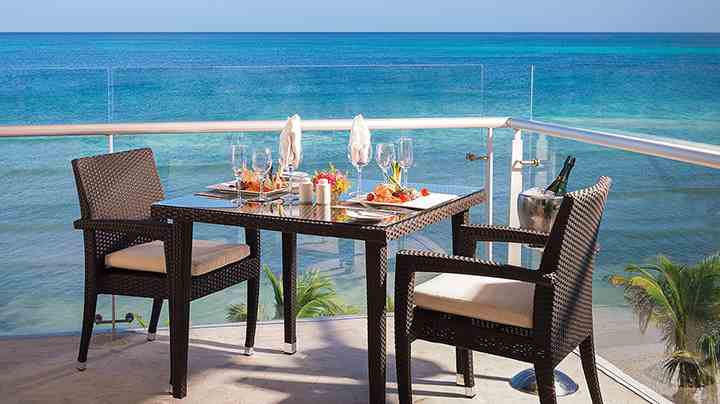 romantic brunch table setting overlooking the ocean at azul beach resort riviera cancun